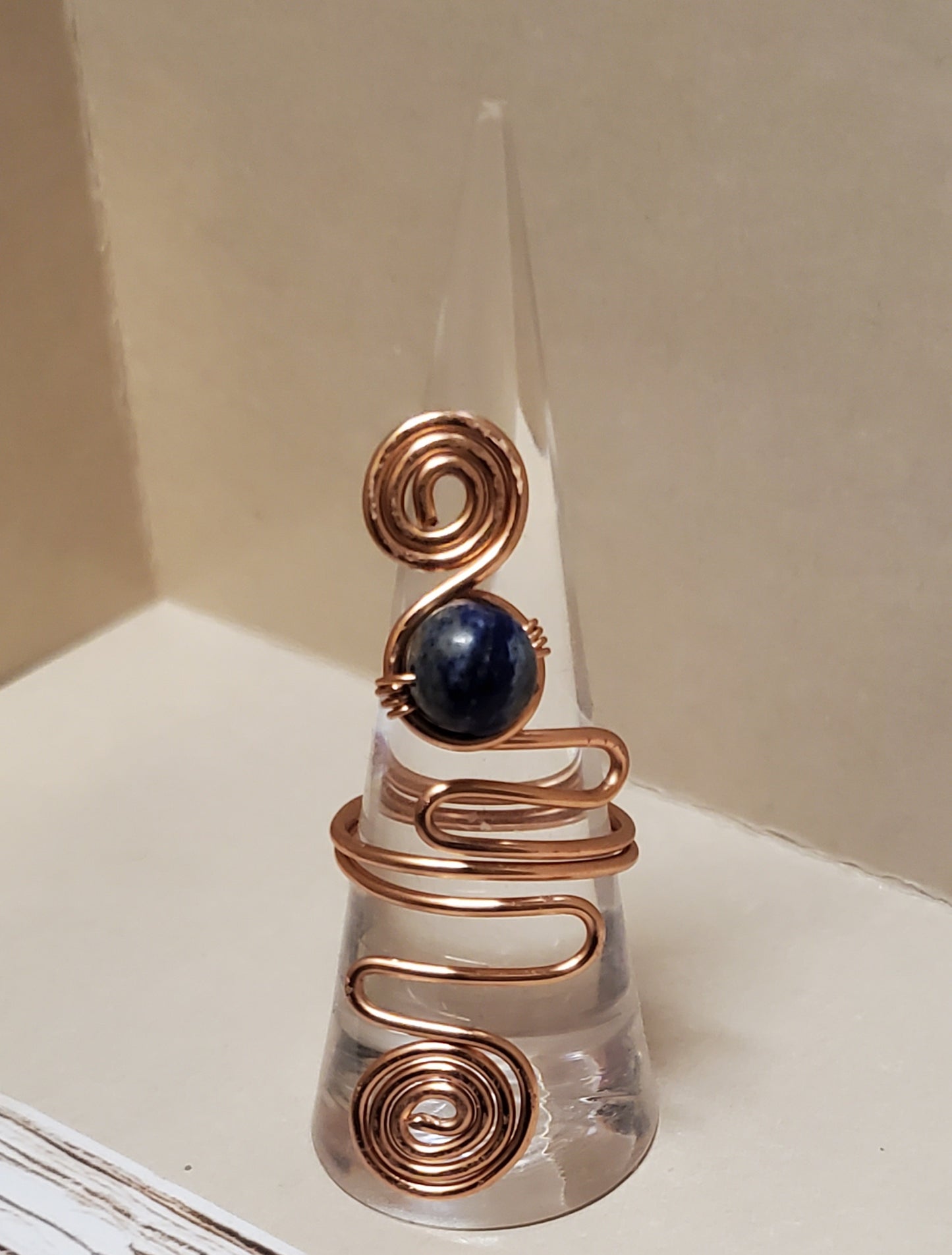 Discover the healing power of our Lapis Lazuli Ring, designed to activate your third eye chakra, boost self-awareness, and empower honest communication. Crafted with tarnish-free copper wire, it's a must-have accessory for empowered women.