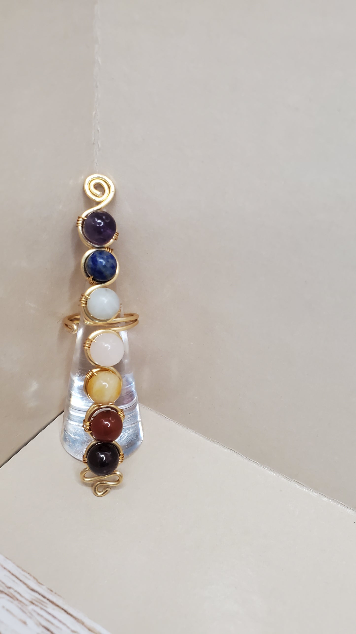Experience inner harmony with our Adjustable Chakra Ring, featuring Amethyst, Lapis Lazuli, and more genuine crystals. Handcrafted with love, it's tarnish-free and hypoallergenic. Order now for balance and healing!