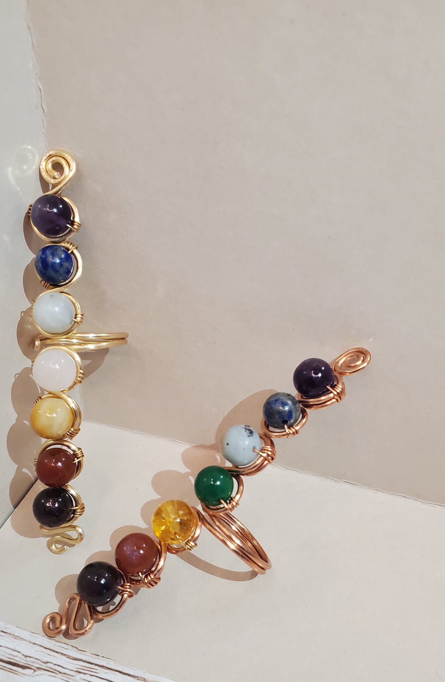 Experience inner harmony with our Adjustable Chakra Ring, featuring Amethyst, Lapis Lazuli, and more genuine crystals. Handcrafted with love, it's tarnish-free and hypoallergenic. Order now for balance and healing!
