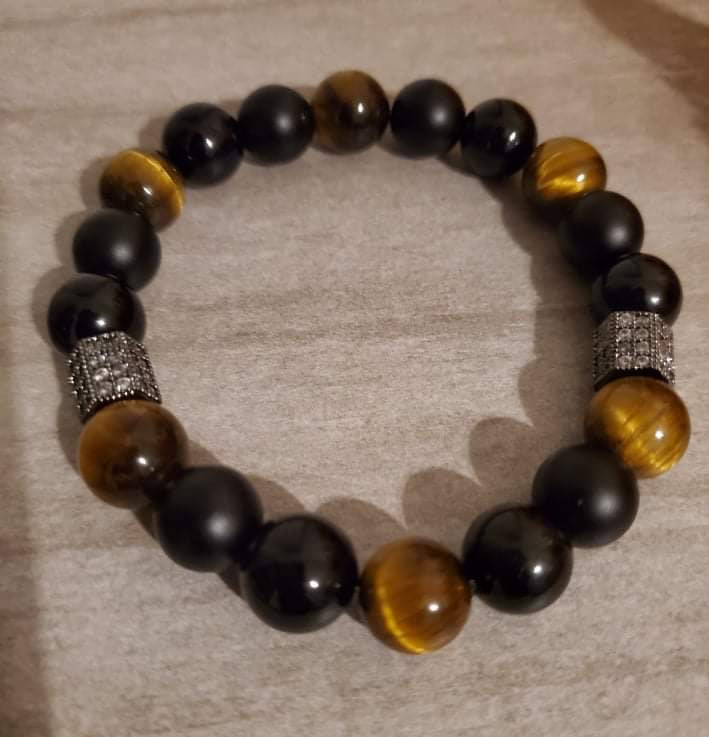 The Tigers Eye Men's Bracelet is a meaningful gift that symbolizes empowerment and strength. Handcrafted with love and care, it's tarnish-free, hypoallergenic, and comfortable to wear. Gift him this bracelet, customized to reflect his unique journey, and watch him step into a world of confidence and empowerment.
